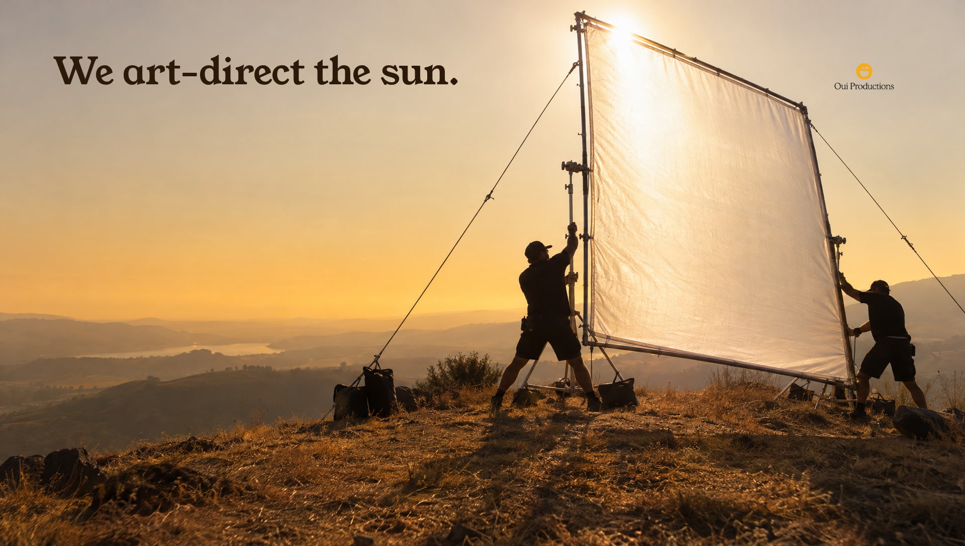 Key art: grips raising a silk against the sun